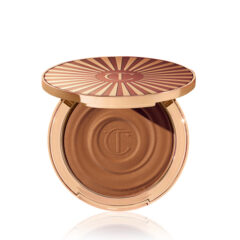 Luxe bronzer compact in goudkleurige verpakking met patroon en gegraveerd logo. Perfect voor een zonnige teint.