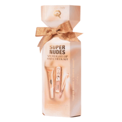 Super Nudes Spotlight Lip and Cheek Kit met gouden strik voor feestelijke make-upcadeaubox.