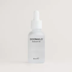 DOONAILS Remover Oil in transparant flesje van 30 ml met pipetdop, ideaal voor nagelverzorging en effectieve verwijdering.