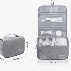 Grijze toilettas met opbergvakken, ritsen en opvouwbaar formaat. Afmetingen: 24x19x9 cm, uitgeklapt 42 cm. Ideaal voor reizen.