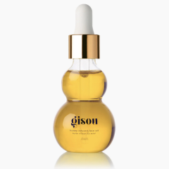 Gouden Gisou gezichtsolie flesje met honingextract en pipet, voor een stralende huidverzorging.