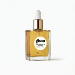 Gisou honing-geïnfuseerde haarolie in een stijlvolle fles van 20 ml voor glanzend en gezond haar.